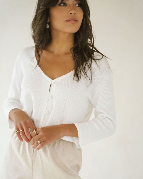woman wearing the organic cotton waffle James Blouse in White by the brand Harly Jae