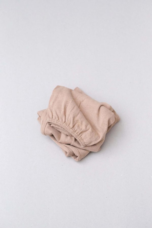 flatlay of the organic cotton Kea Skirt in Camel by the brand Harly Jae