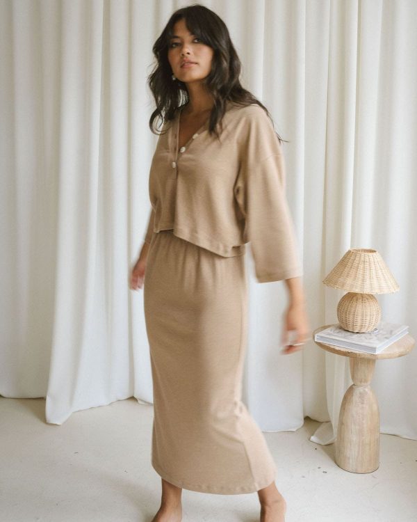 woman wearing the organic cotton Kea Skirt & Porto Henley in Camel by the brand Harly Jae