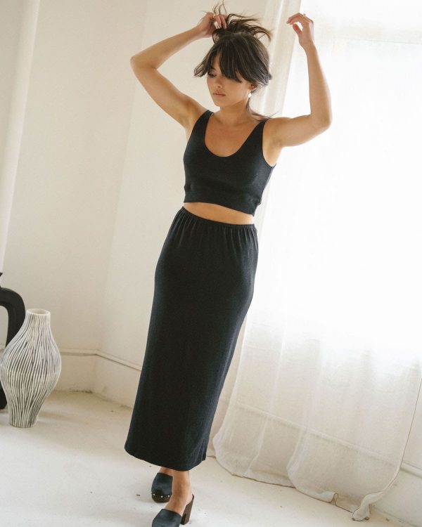 woman wearing the organic cotton Kea Skirt & Top in Black by the brand Harly Jae