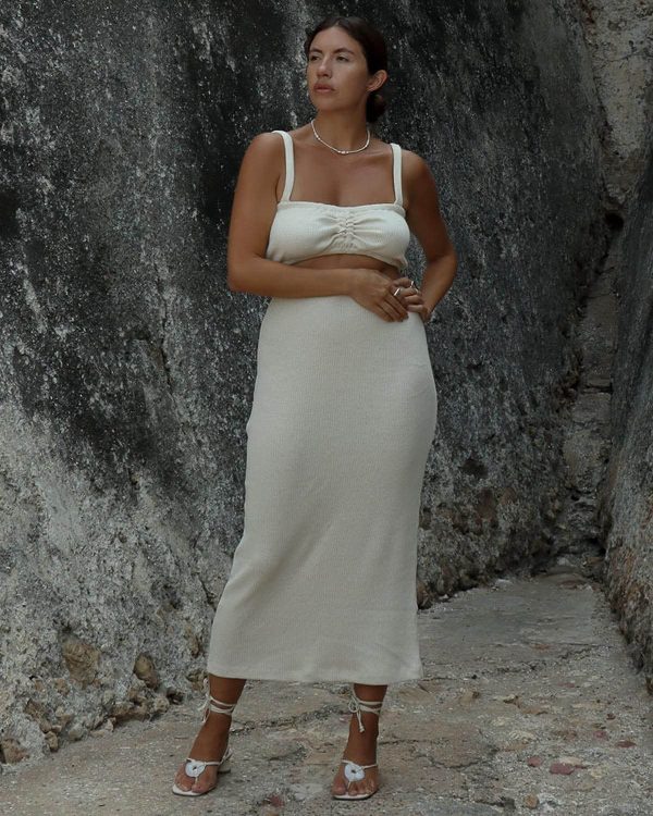 woman wearing the organic hemp & cotton Kea Skirt in Off-White by the brand Harly Jae