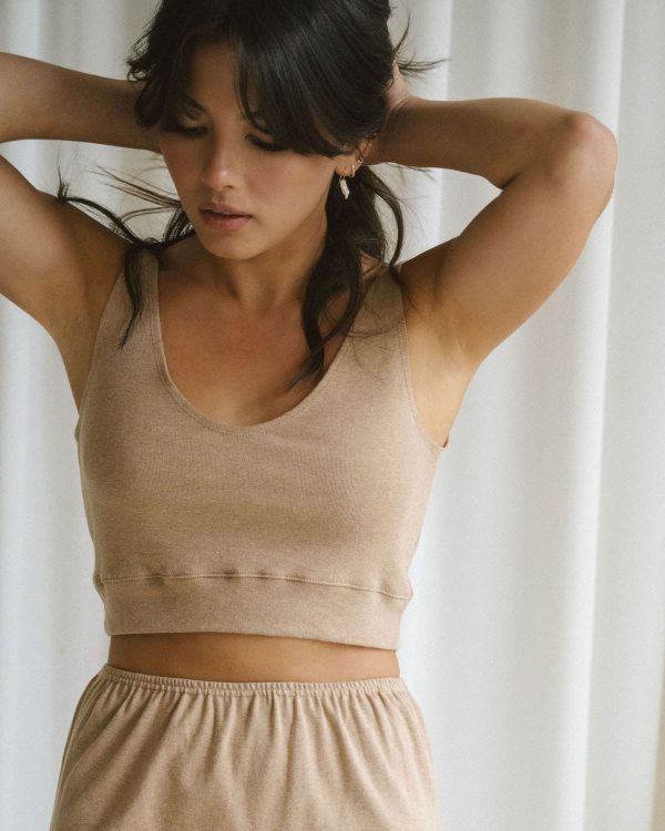 woman wearing the organic cotton Kea Top & Skirt in Camel by the brand Harly Jae