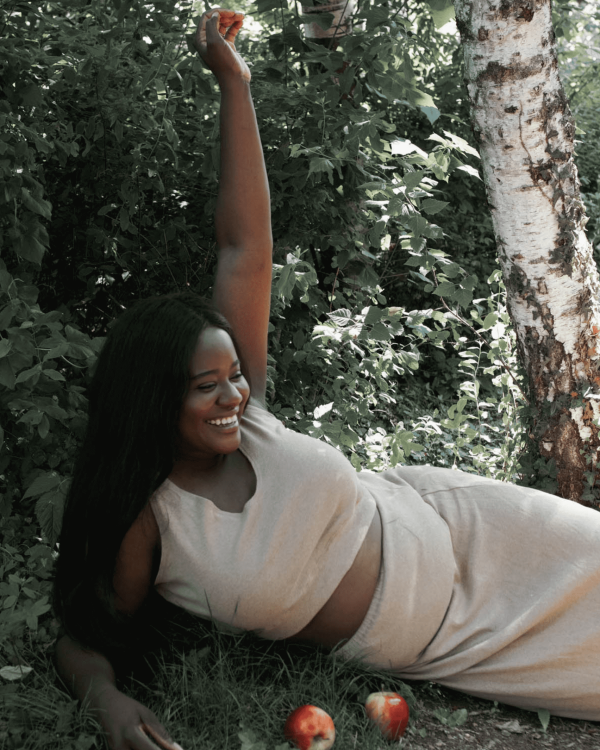 woman wearing the organic cotton Kea Top & Skirt in Camel by the brand Harly Jae