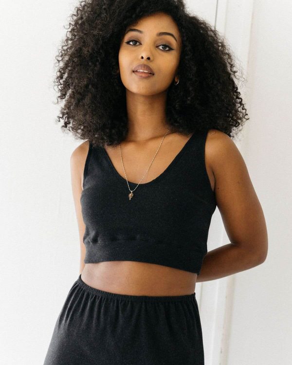 woman wearing the organic cotton Kea Top & Kea Skirt in Charcoal by the brand Harly Jae