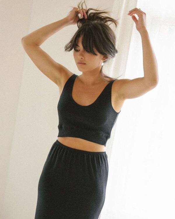 woman wearing the organic cotton Kea Top & Kea Skirt in Charcoal by the brand Harly Jae