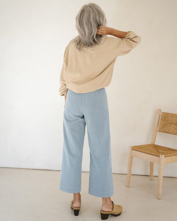 woman wearing the organic cotton Pierrot Pants in Light Denim by the brand Harly Jae