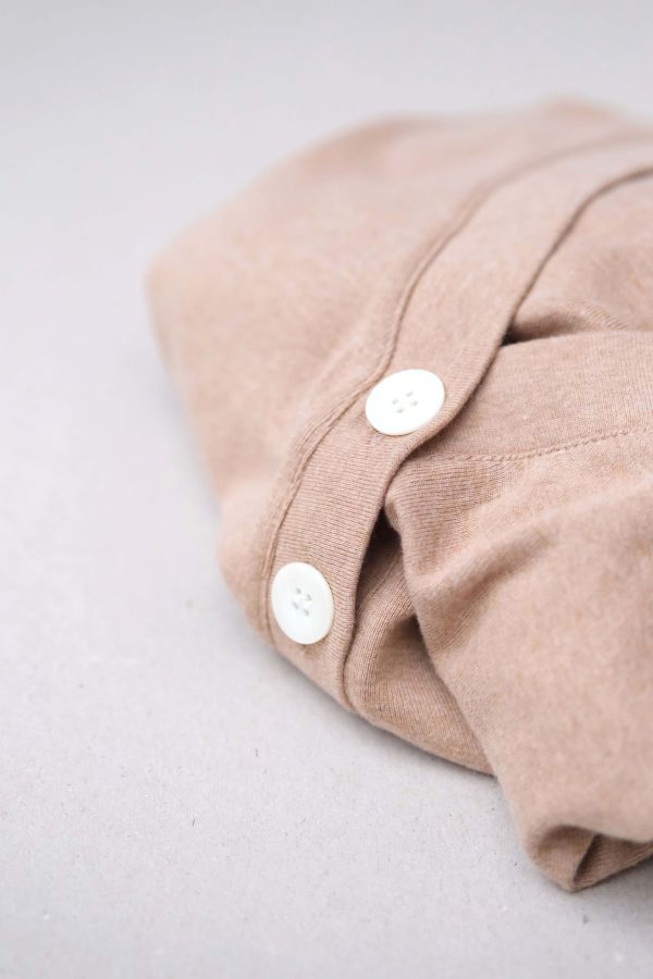 flatlay of the organic cotton Porto Henley in Camel by the brand Harly Jae