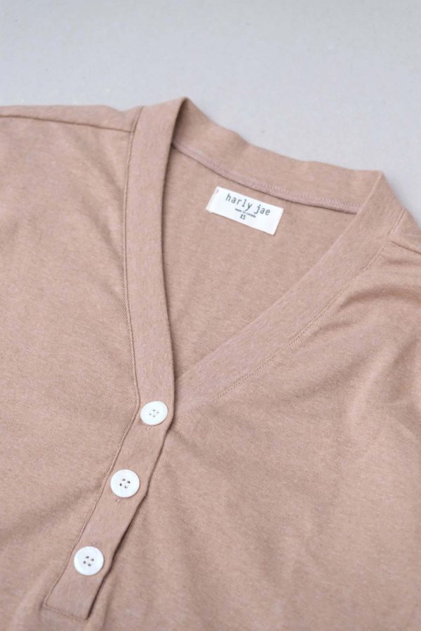 flatlay of the organic cotton Porto Henley in Camel by the brand Harly Jae