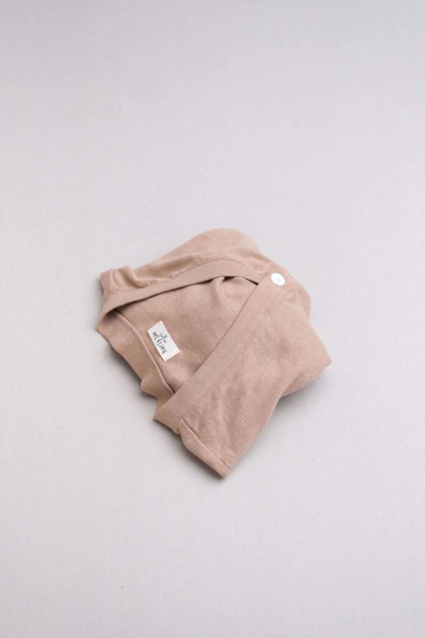 flatlay of the organic cotton Porto Henley in Camel by the brand Harly Jae
