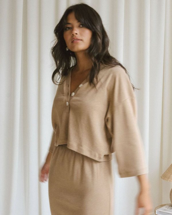 woman wearing the organic cotton Porto Henley & Kea Skirt in Camel by the brand Harly Jae