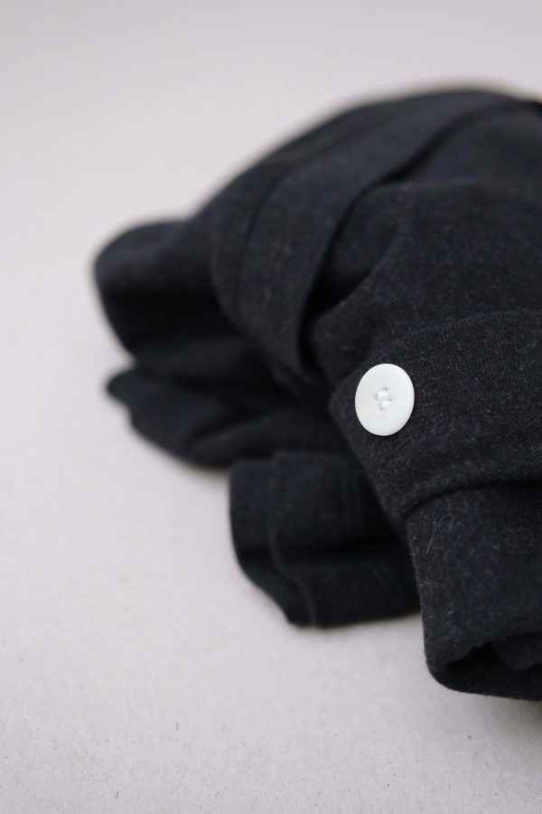 flatlay of the organic cotton Porto Henley in Charcoal by the brand Harly Jae