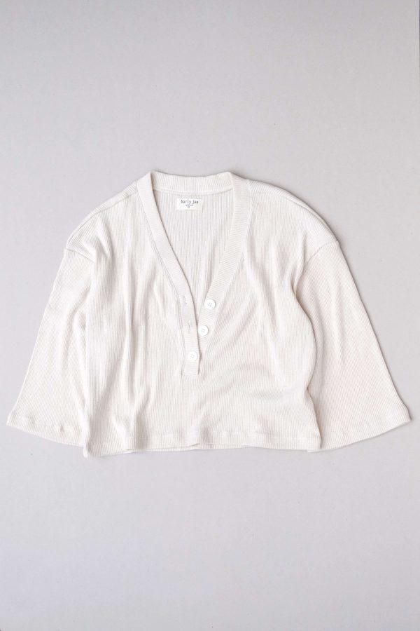 flatlay of the organic cotton Porto Henley in Off-White by the brand Harly Jae