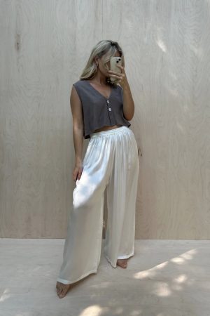 the Ona Button Up in Taupe paired with the silk Jai Pant in White by the sustainable brand Bahhgoose, curated by Morsel Store