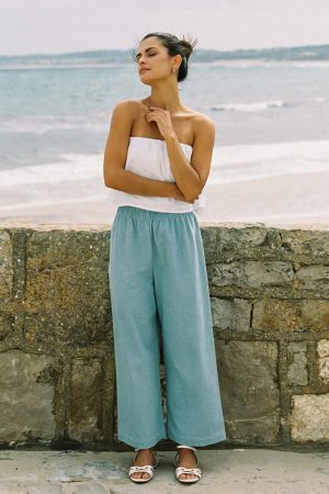 woman wearing the Aura Pants in light denim cotton by the sustainable brand Harly Jae, curated by Morsel Store