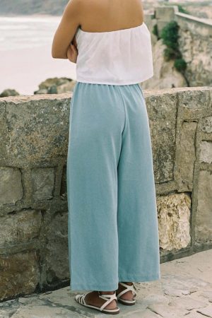 woman wearing the Aura Pants in light denim cotton by the sustainable brand Harly Jae, curated by Morsel Store