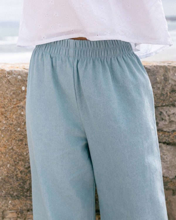 woman wearing the Aura Pants in light denim cotton by the sustainable brand Harly Jae, curated by Morsel Store