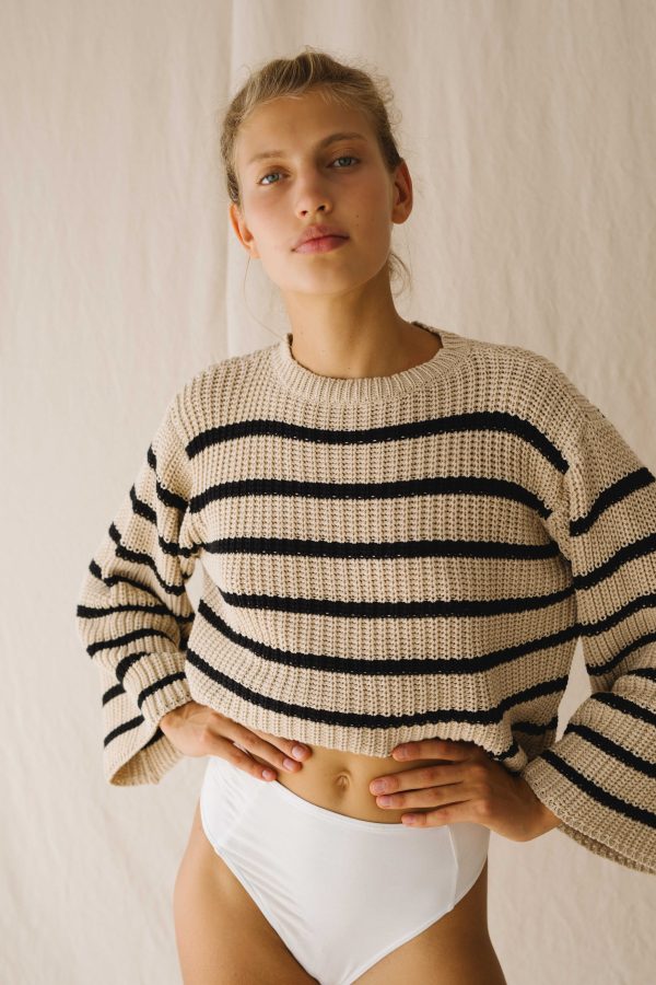 Woman wearing the striped Maria Knit by the brand The Bare Road