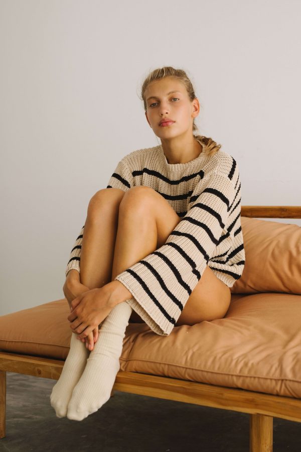 Woman wearing the striped Maria Knit by the brand The Bare Road