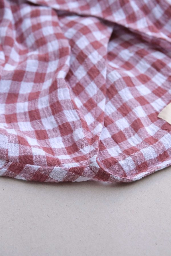 the Mia Wrap Top in Cherry Gingham by the brand The Bare Road