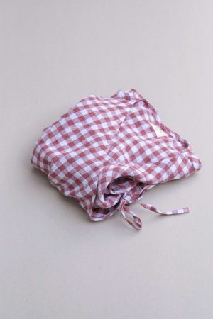 the Mia Wrap Top in Cherry Gingham by the brand The Bare Road