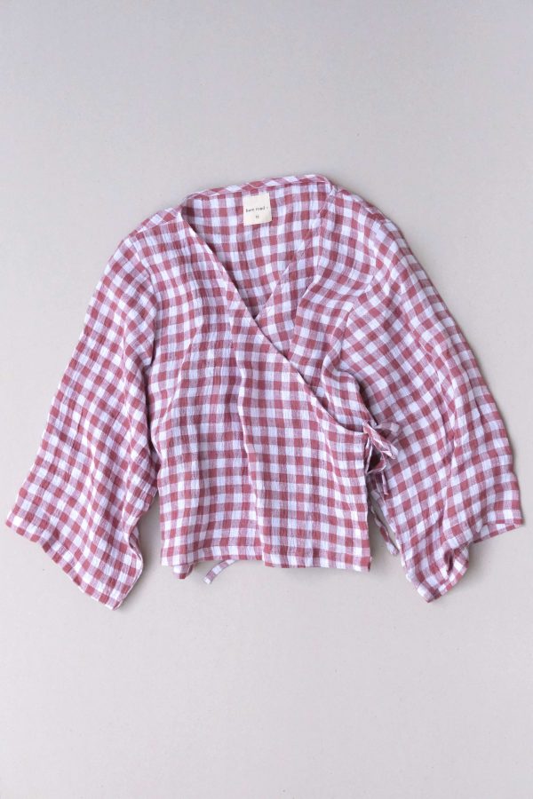 the Mia Wrap Top in Cherry Gingham by the brand The Bare Road