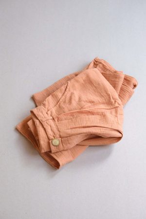 the Poppy Pants in Peach by the brand The Bare Road