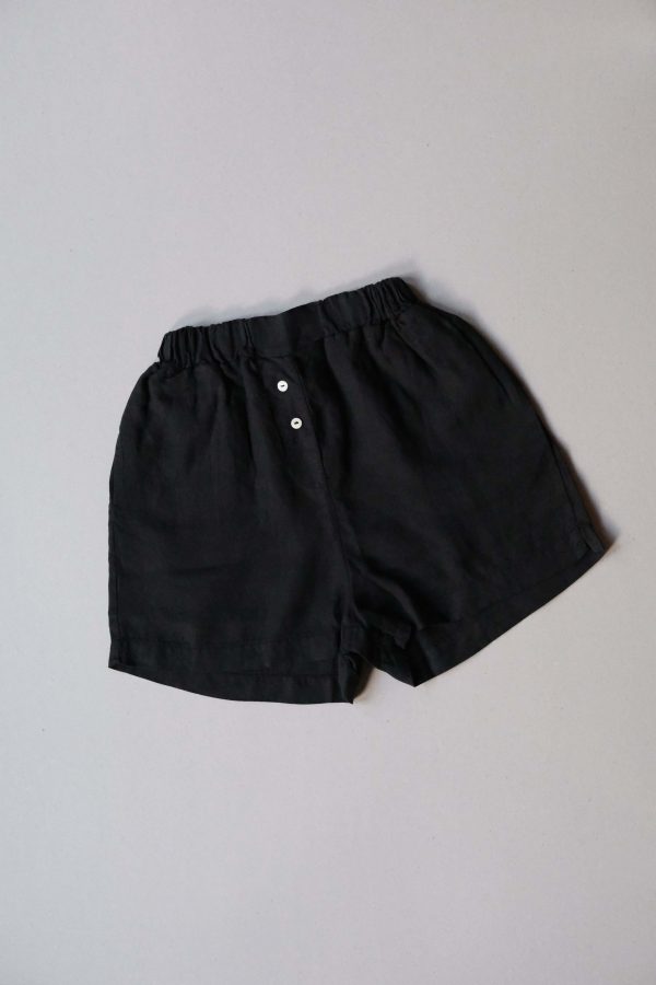 flatlay of the Allie Shorts in Black by the brand The Sept