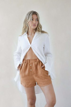 woman wearing the Gabrielle Shorts in Caramel by the brand The Sept