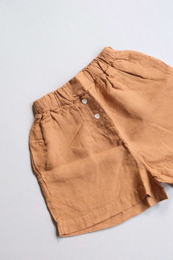 flatlay of the Gabrielle Shorts in Caramel by the brand The Sept