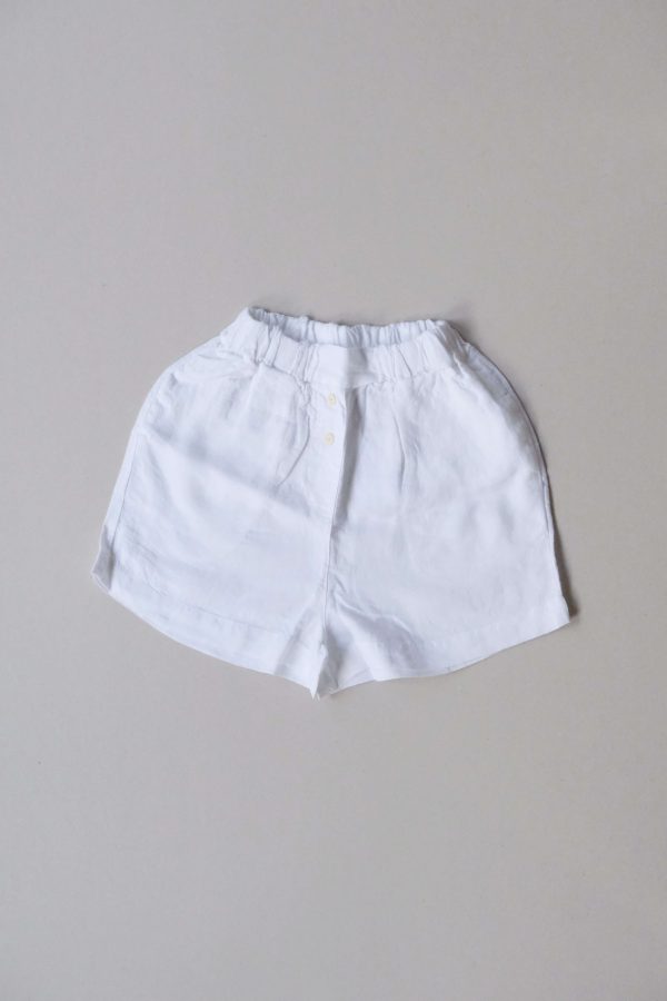 flatlay of the Gabrielle Shorts in White by the brand The Sept