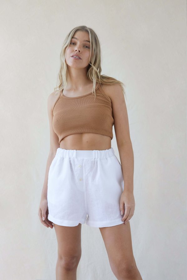 woman wearing the Gabrielle Shorts in White by the brand The Sept