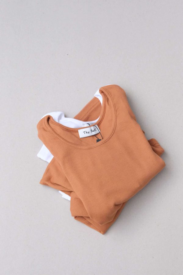flatlay of the Mel Longsleeve in Caramel & White by the brand The Sept