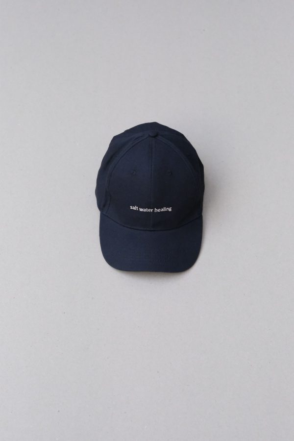 flatlay of the Peck 90s Cap by the brand The Sept