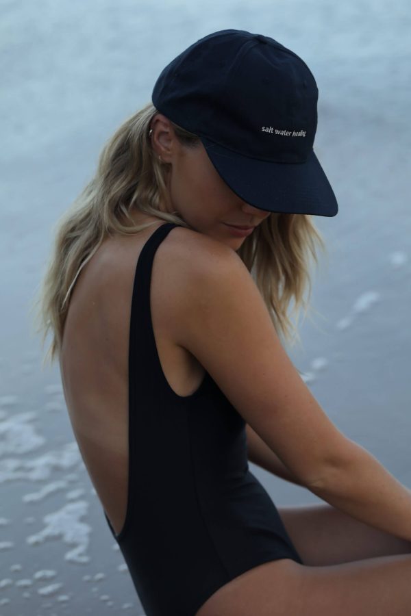 woman wearing the Peck 90s Cap by the brand The Sept