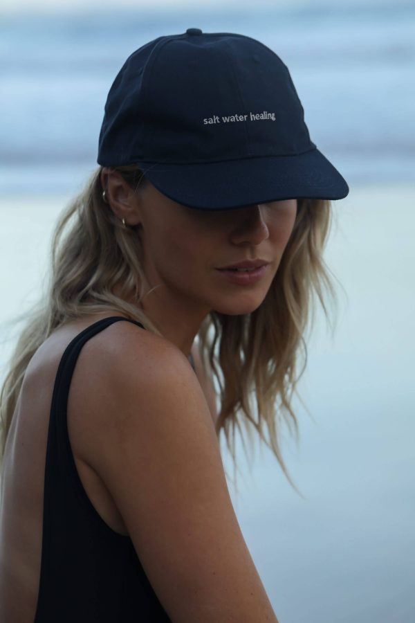 woman wearing the Peck 90s Cap by the brand The Sept