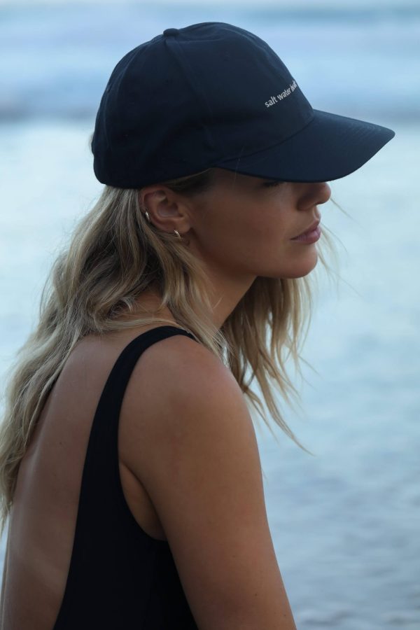 woman wearing the Peck 90s Cap by the brand The Sept