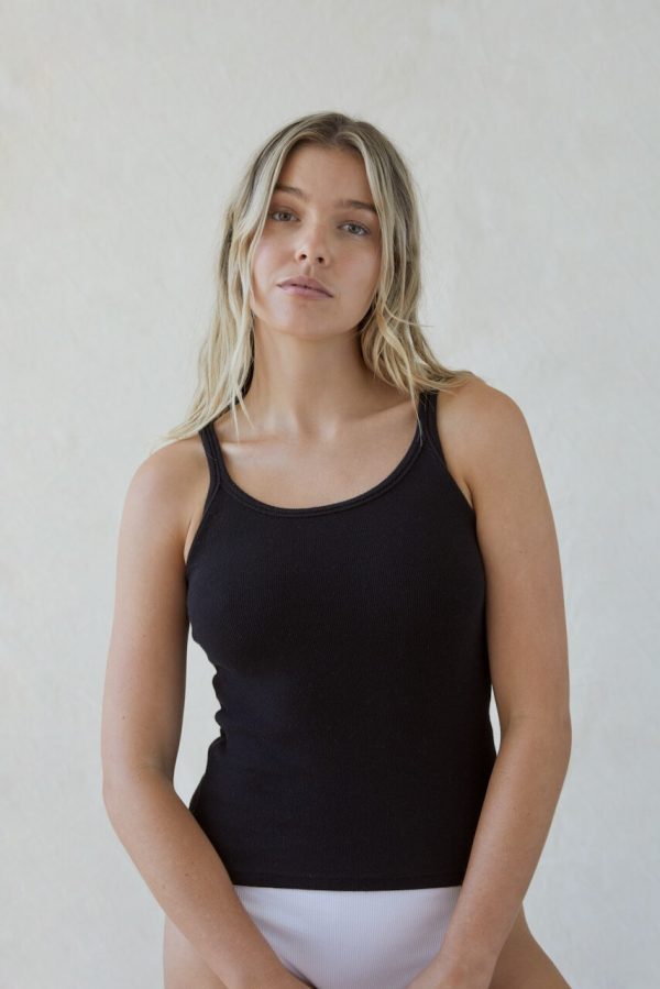 woman wearing the Rachel 90s Tank in black by the brand The Sept