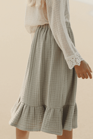 the Claudia skirt in Dried Herb paired with the Marya Blouse by the brand Yoli and Otis