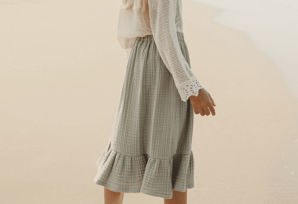 the Claudia skirt in Dried Herb by the brand Yoli and Otis