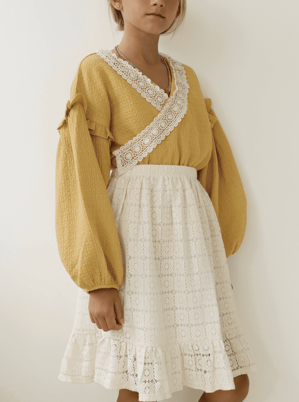 the Claudia skirt in Undyed paired with the Rauf Top by the brand Yoli and Otis