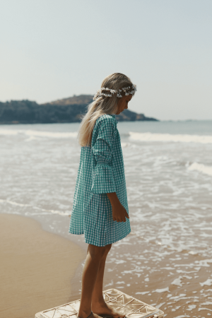 the Dalia Dress in Apple Plaid by the brand Yoli & Otis