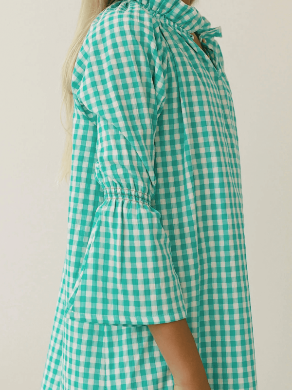 the Dalia Dress in Apple Plaid by the brand Yoli & Otis