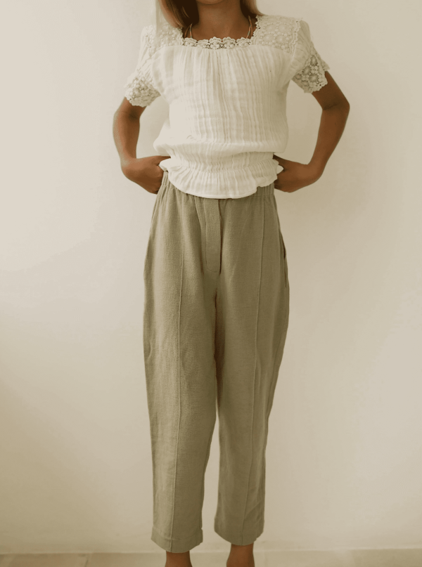 the Hassan Trousers in Dried Herb paired with the Dana Top by the brand Yoli & Otis