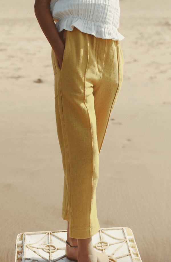 the Hassan Trousers in Parsnip by the brand Yoli & Otis