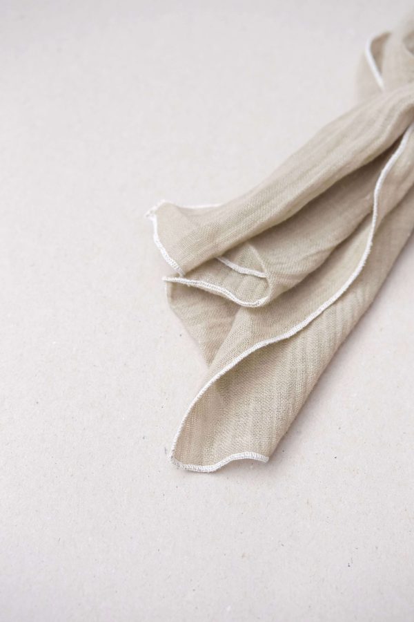 the Loretta Scarf in Dried Herb with Off-white Stitch by the brand Yoli & Otis