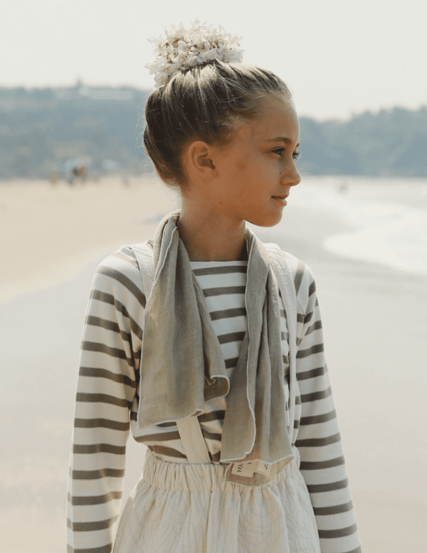 the Loretta Scarf in Dried Herb with Off-white Stitch paired with the Romeo Skirt by the brand Yoli & Otis