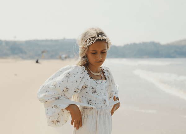 the Louilian blouse in Vintage Floral paired with the Romeo Skirt by the brand Yoli & Otis