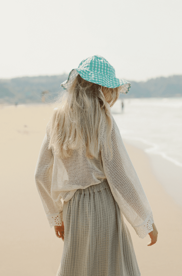 the Marya Blouse in Undyed paired with the Claudia Skirt by the brand Yoli & Otis