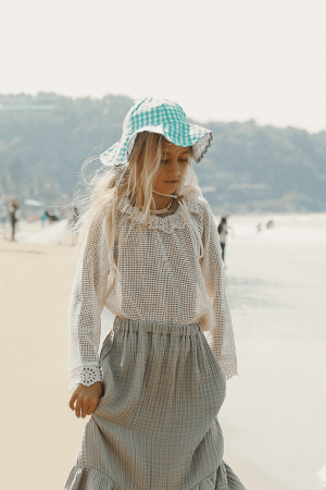 the Marya Blouse in Undyed paired with the Claudia Skirt by the brand Yoli & Otis