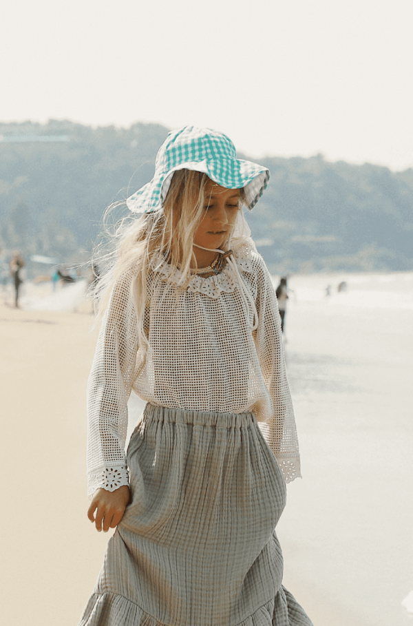 the Marya Blouse in Undyed paired with the Claudia Skirt by the brand Yoli & Otis